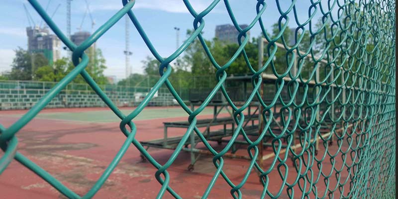 Green residential Chain Link fence installation in Salt Lake City, Utah
